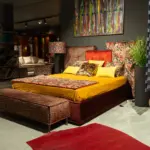 Letto imbottito con testiera arancio – altra vista – Confort Salotti